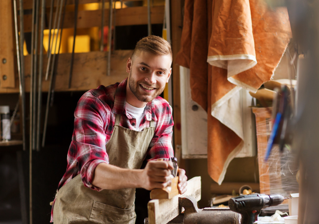 man building a product manually