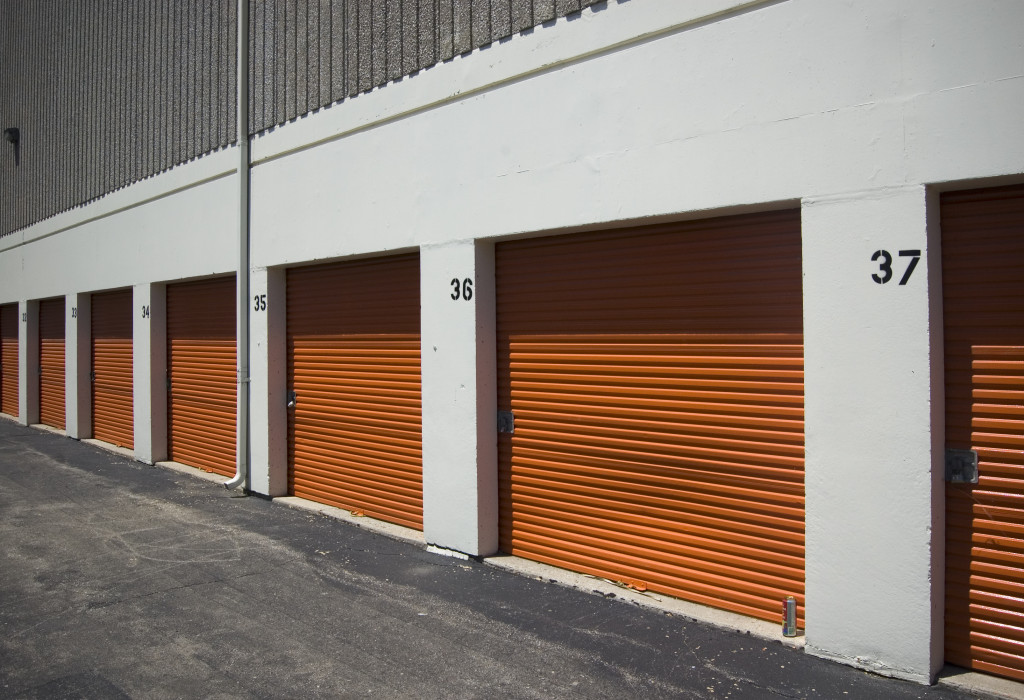 Multiple self-storage storage units with metal pull-down doors.