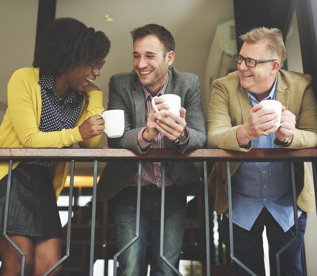 In a home-based cafe, employees are sipping coffee on the balcony.