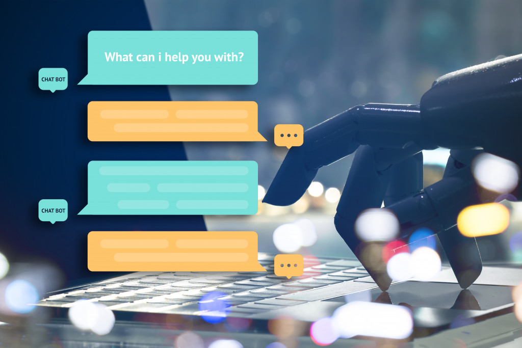 a chatbot graphic with a robot shown typing on laptop