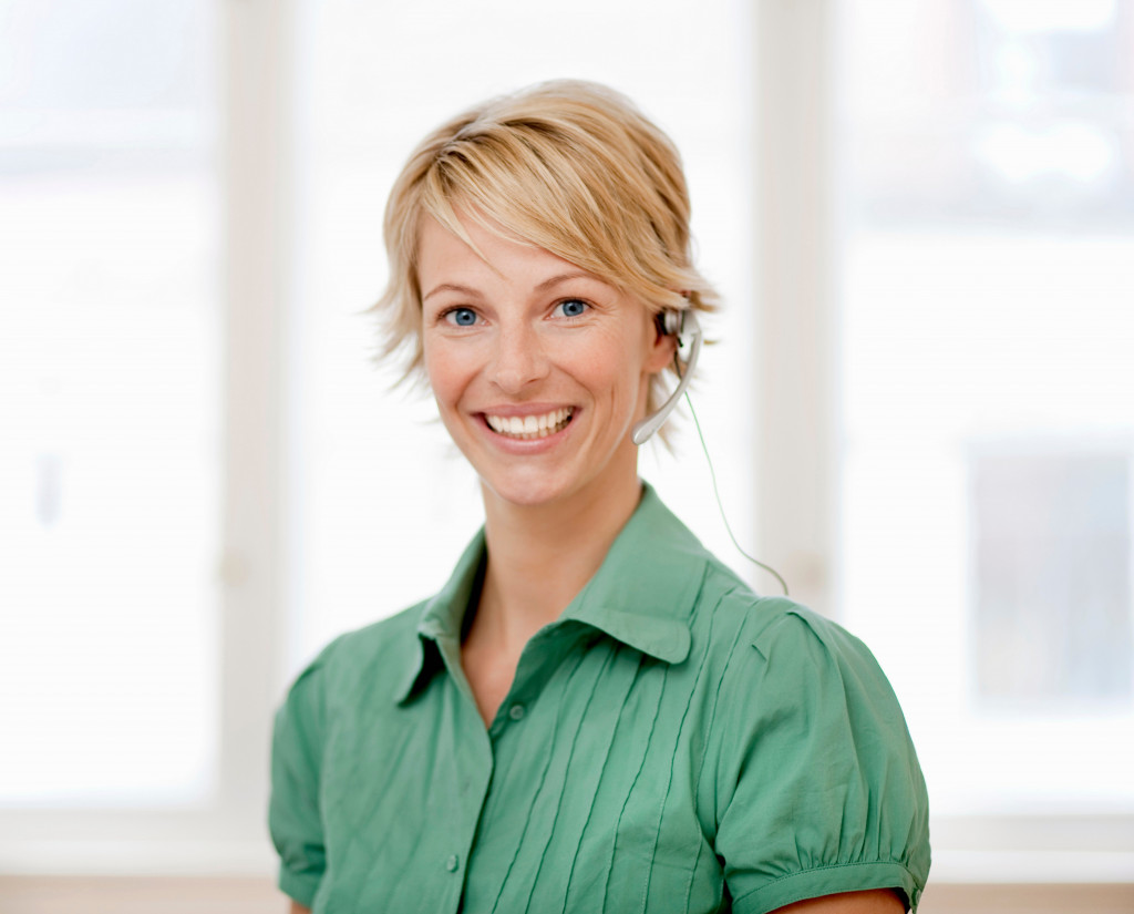 A woman looking at the camera while smiling