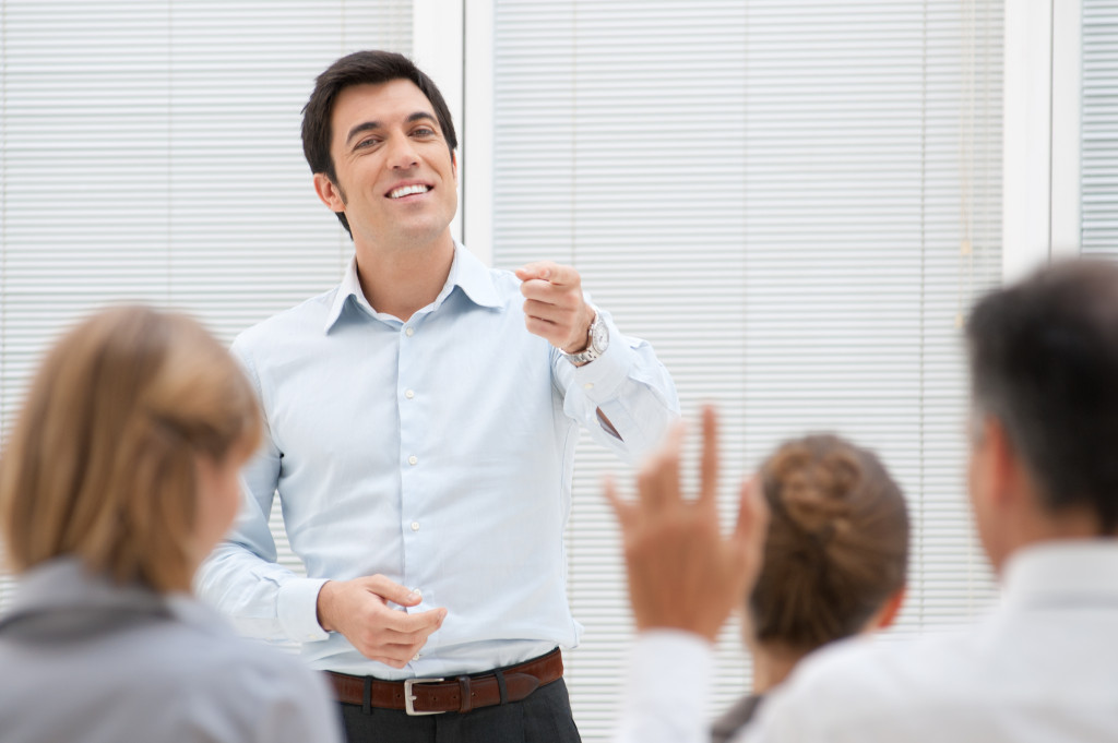 A businessman speaking in front of an audience