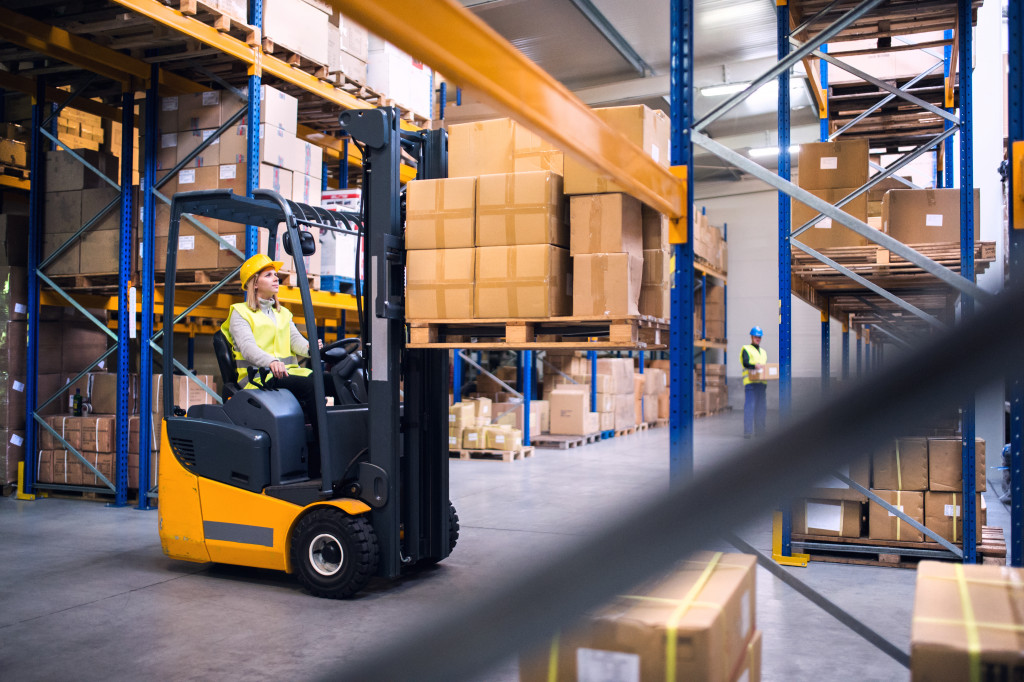 Forklift being used by warehouse employee