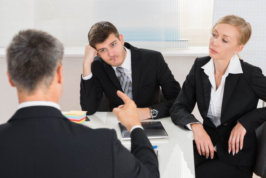 manager discussing with his employees