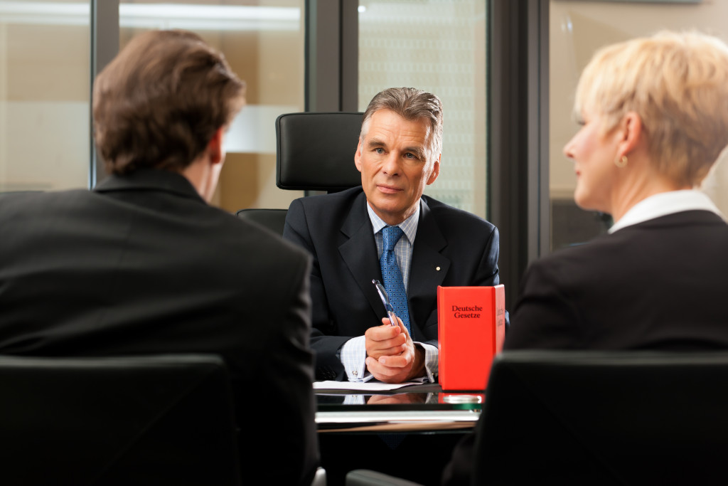 lawyer with his clients