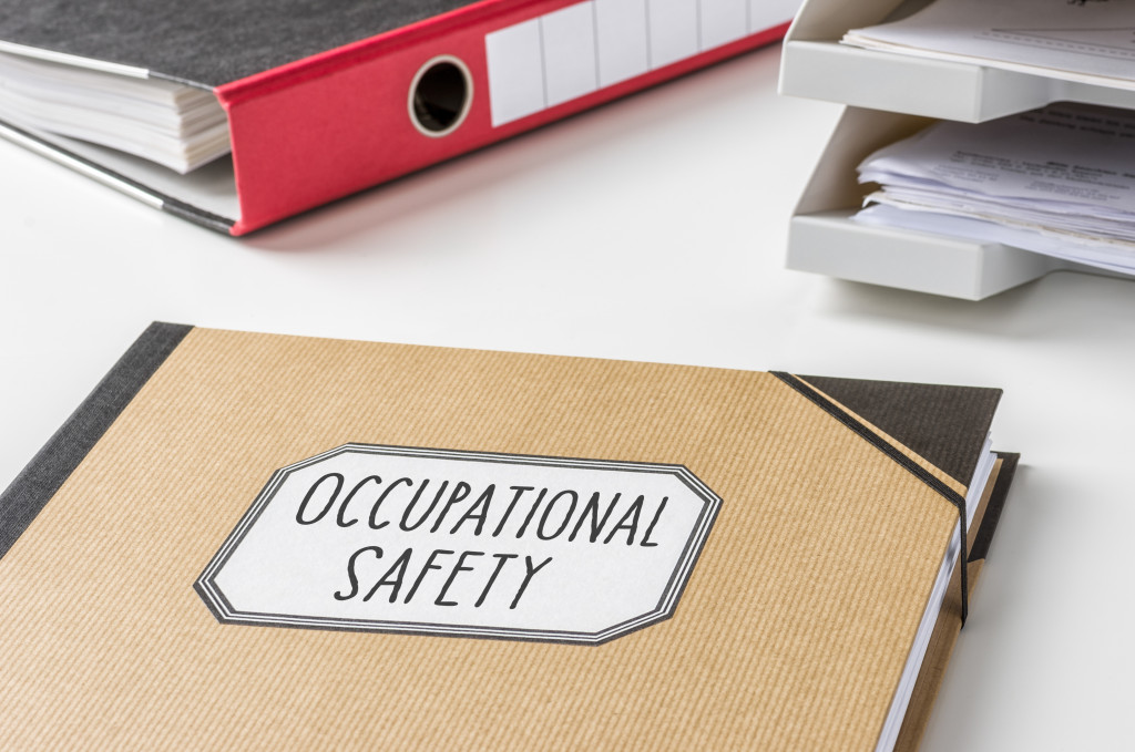 bound folder of occupational safety in a white desk