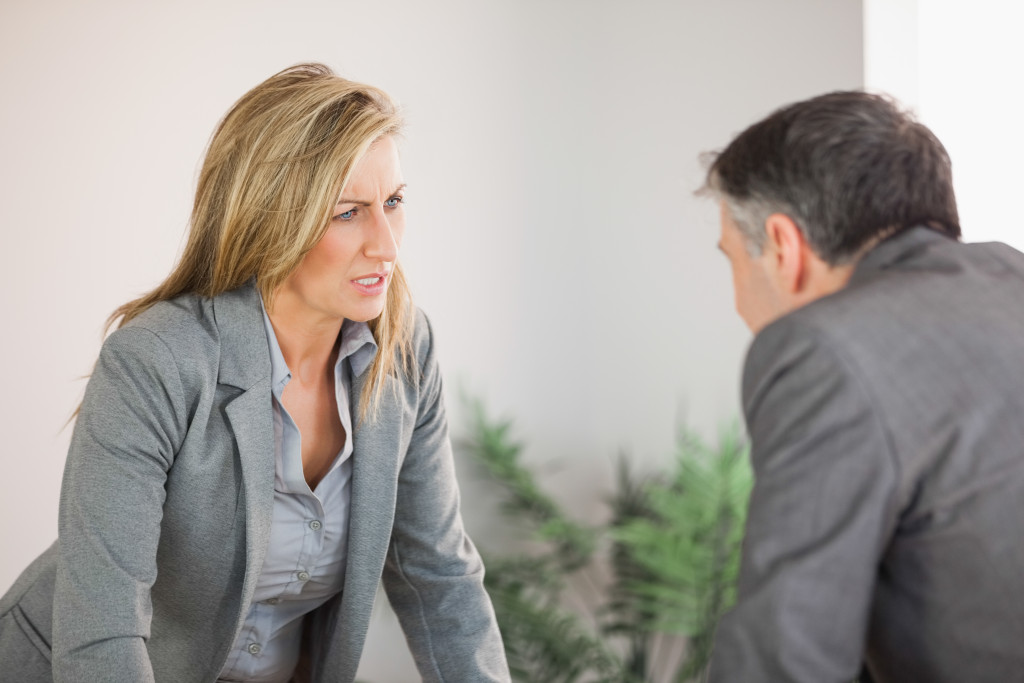 angry woman with a male colleague