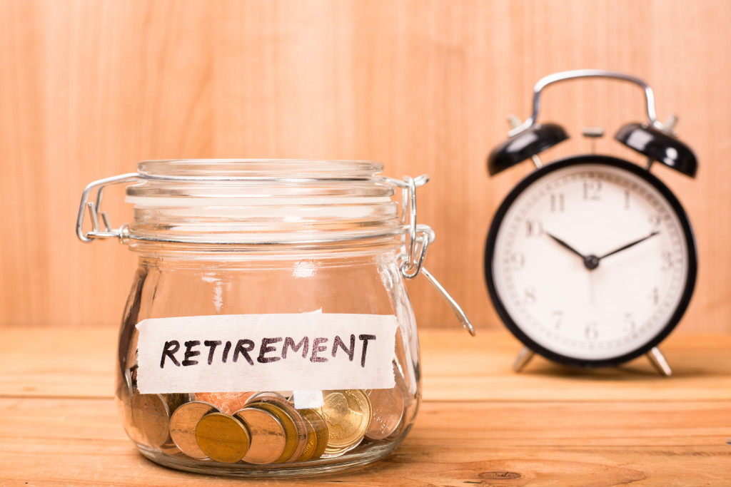 retirement plans represented by glass and clock