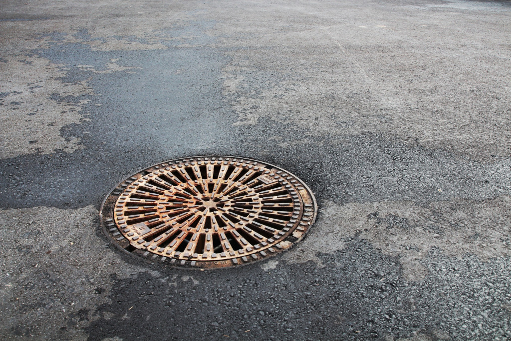 A sewer cover on a road